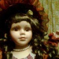 Фарфоровая коллекционная кукла Ремеко
