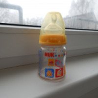 Стеклянная бутылочка NUK First Choice с ортодонтической антиколиковой соской