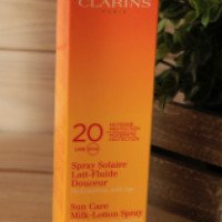 Солнцезащитное увлажняющее молочко спрей для лица и тела Clarins